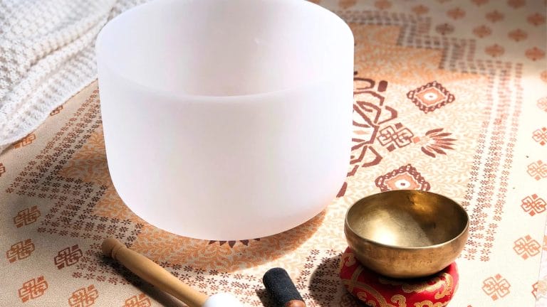 Premium crystal bowls and yoga mats in a boutique hotel room for private wellness sessions.