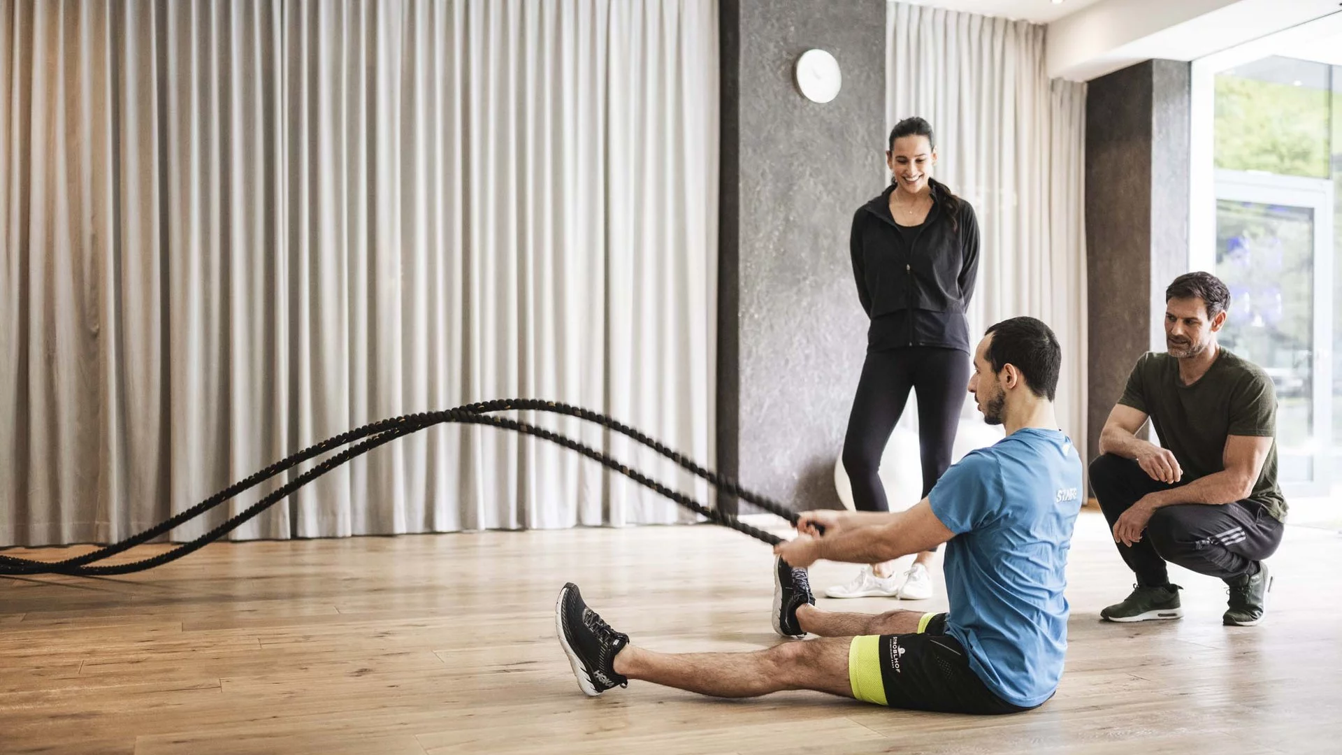 Modern hotel gym with crystal singing bowls for post-workout meditation and recovery