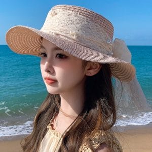 Eco-conscious wide-brim straw sun hat with optional resort logo embroidery, designed for sustainable tourism branding.