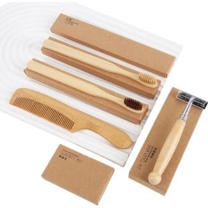Bamboo shaving kit with FSC-certified handle and biodegradable components on marble bathroom tray