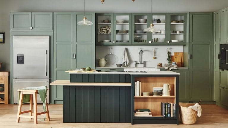 Matte black kitchen island with built-in wine cooler and breakfast bar in a contemporary open-plan design