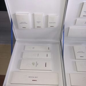 Customizable Hotel Amenity Kits with gold foil branding and 12 color palettes, luxury resort amenities