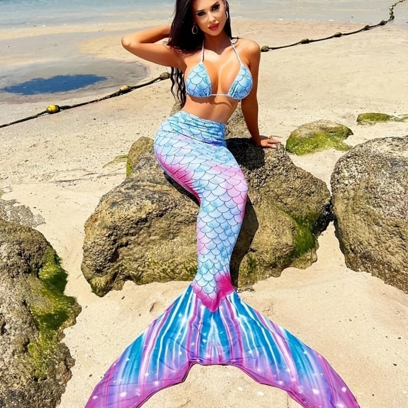 Kids laughing in hotel pool with oversized swimmable mermaid tails, family vacation memories