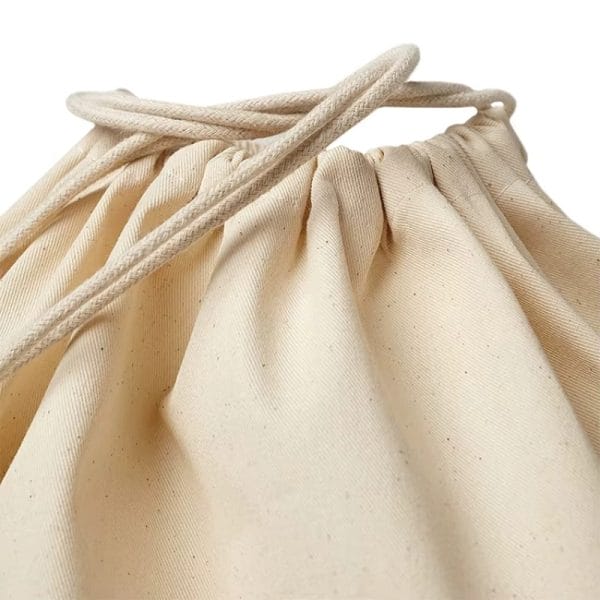 Canvas laundry bags submerged in water during a waterproof test at a Red Sea coastal hotel, showing no leakage.