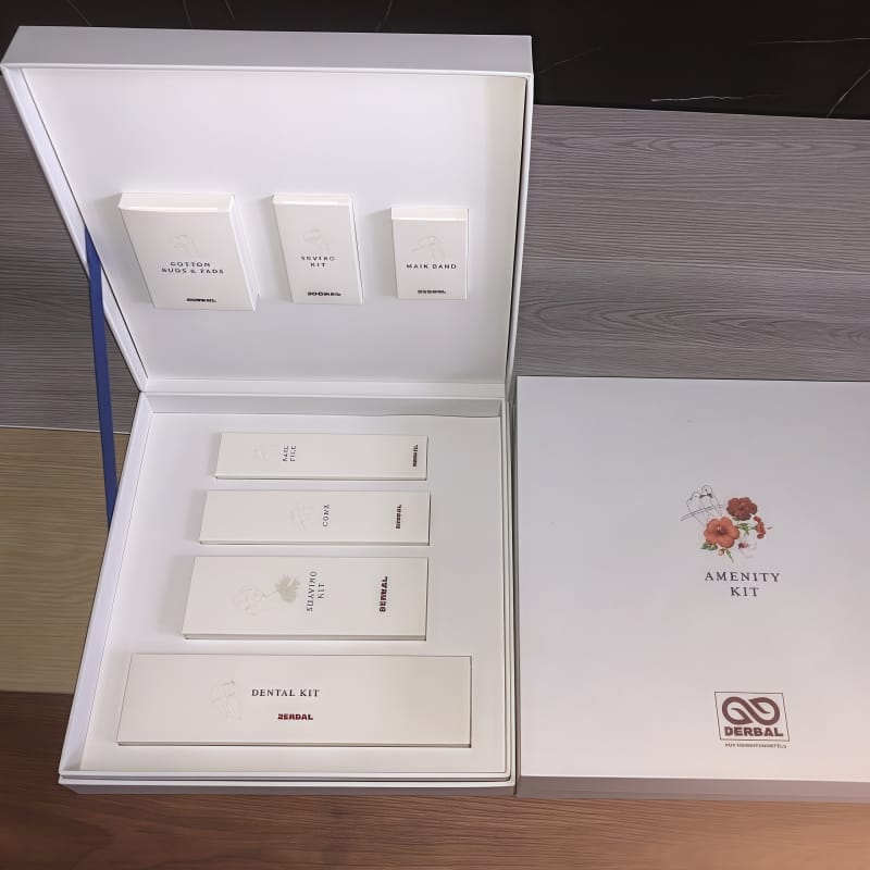 Hotel Amenity Kits in FSC-certified coated paper with gold-thread embroidery, eco-friendly luxury hotel supplies