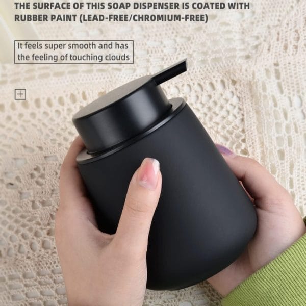 Ceramic soap dispenser with motion sensor, hotel bathroom.