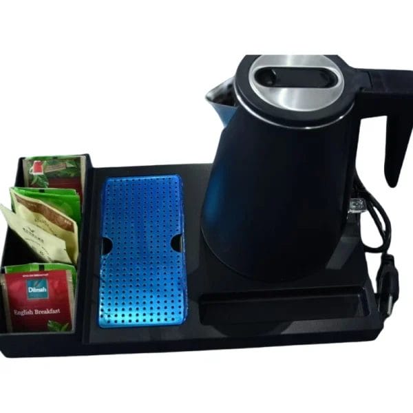 Small electric tea kettle with silicone base for hotel bathrooms or compact guest rooms
