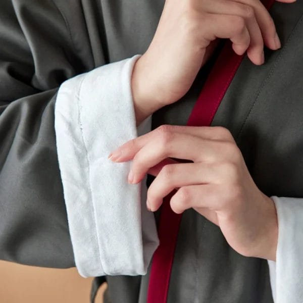 Close-up texture of Luxury Double Layer Hotel Bathrobe's inner 100% combed cotton terry, ultra-plush for skin comfort and rapid moisture absorption.