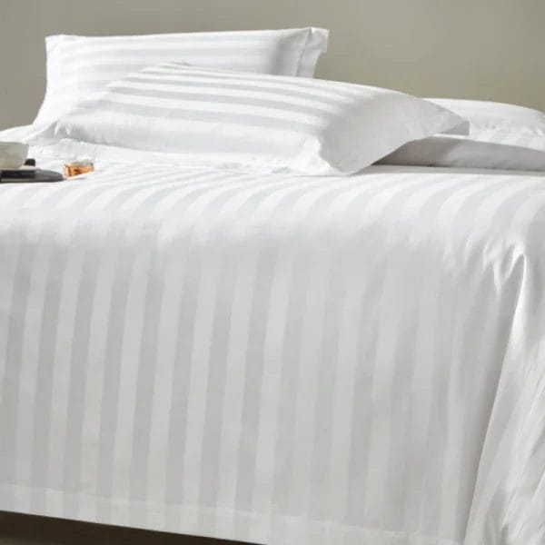 DERBAL cotton bedding in Burj Al Arab desert suite, showing dry surface after moisture-wicking test (ISO 6330)
