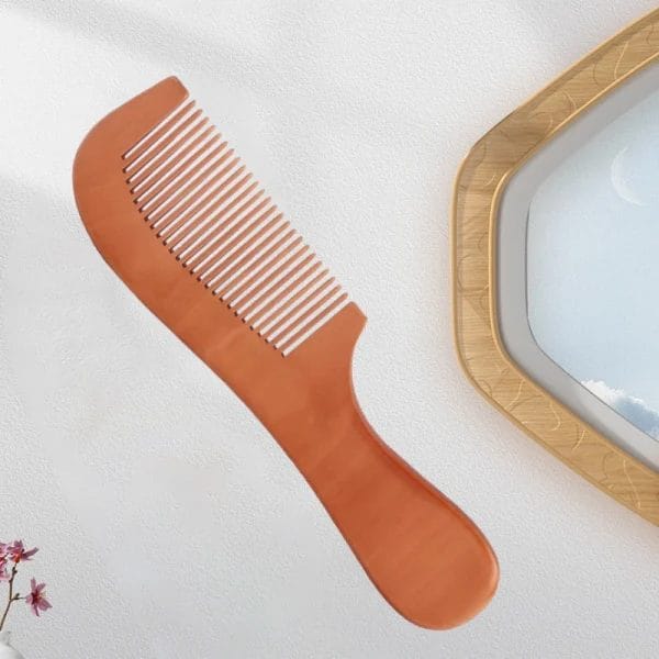Post-Swim Hair Detangling | Guest Using Hotel Comb at Constance Moofushi Maldives