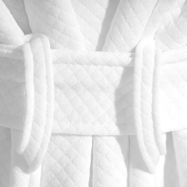 Triple-stitched hood reinforcement on luxury hotel bathrobes – survives 50kg tension testing.