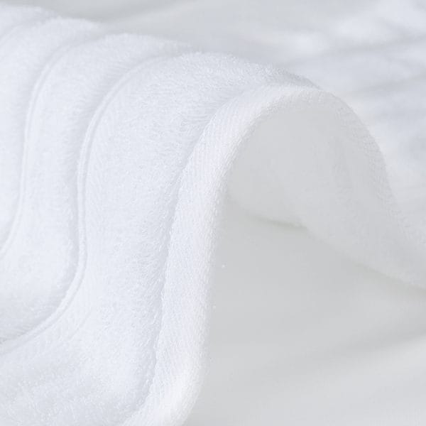 Reinforced double-stitched edges on Hotel Bath Towels after 2 years of use at Waldorf Astoria Maldives.