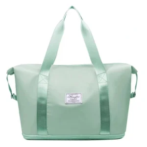 Foldable & Expandable Travel Bag secured onto rolling luggage via its fixed back strap.