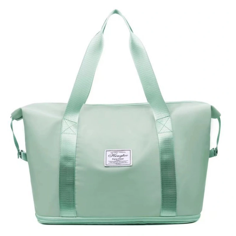Foldable & Expandable Travel Bag secured onto rolling luggage via its fixed back strap.