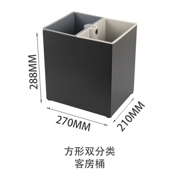 A compact, 5-10 liter Guestroom Waste bins placed discreetly under a hotel room desk.
