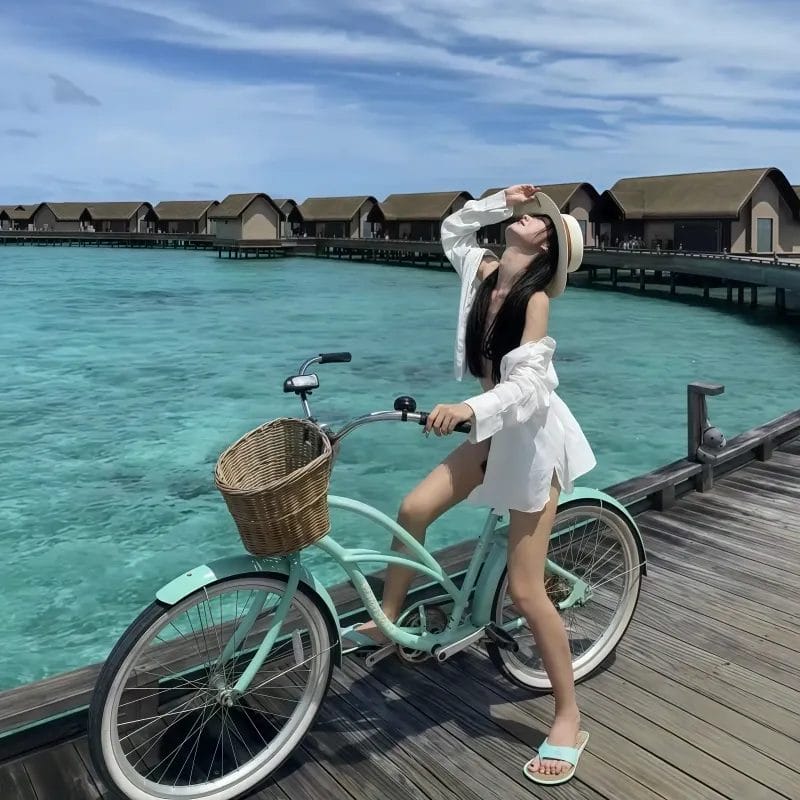 The Coast Beach Bike Island Cruiser fleet lined up at a resort for guest use, emphasizing its value as a premium amenity.