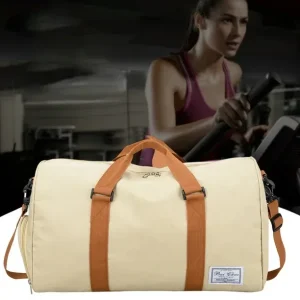 A close-up showing the dry-wet separated compartment of the Travel Bags Duffel Bag with a towel inside.