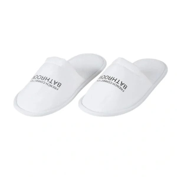 A side-angle of the Hotel Velour Slippers, focusing on the thick, durable sole designed for longevity.