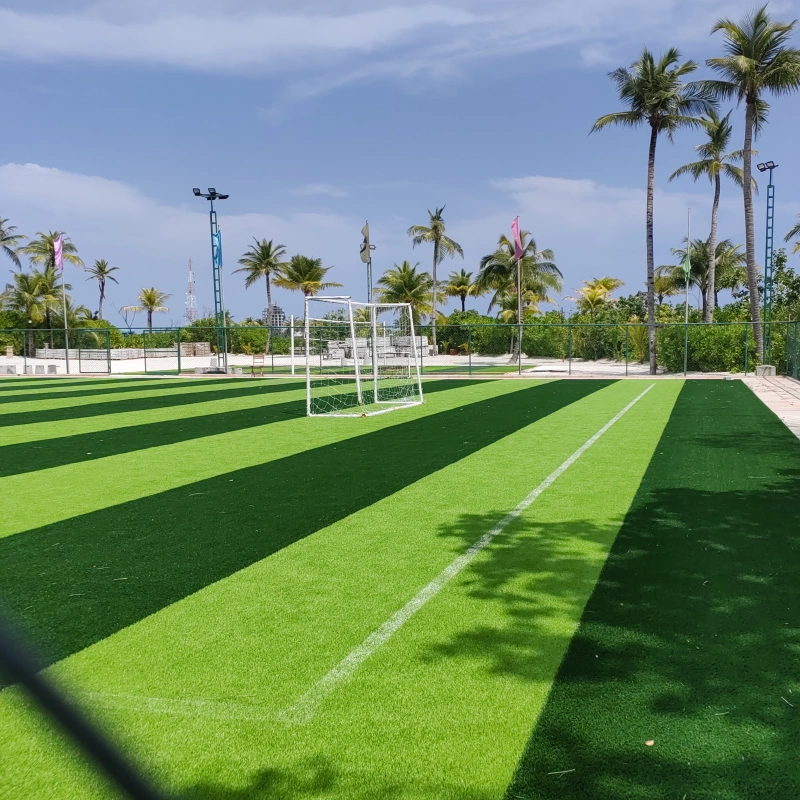Close-up of high-quality Football Turf fibers, showcasing their durability and wear resistance for continuous play.