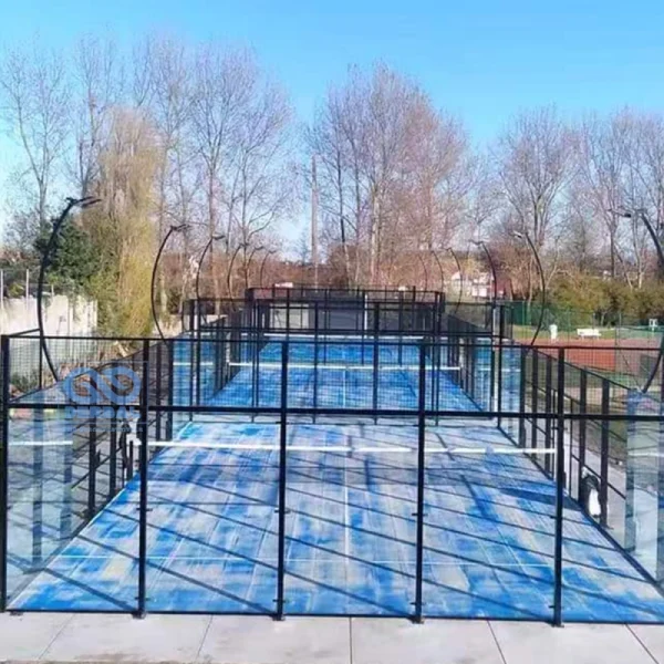 Guests actively enjoying a social game of doubles on a Padel Court, emphasizing the sport's fun and social nature.