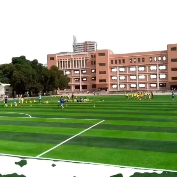 A Football Turf pitch in a sports club being used for a high-traffic training session, showing its durability.