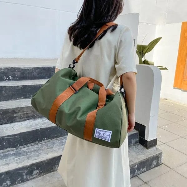 A person effortlessly carrying the lightweight Travel Bags Duffel Bag, emphasizing its 1LB weight.