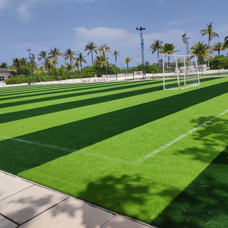 A pristine Football Turf field with minimal upkeep, illustrating its low-maintenance advantage over natural grass.