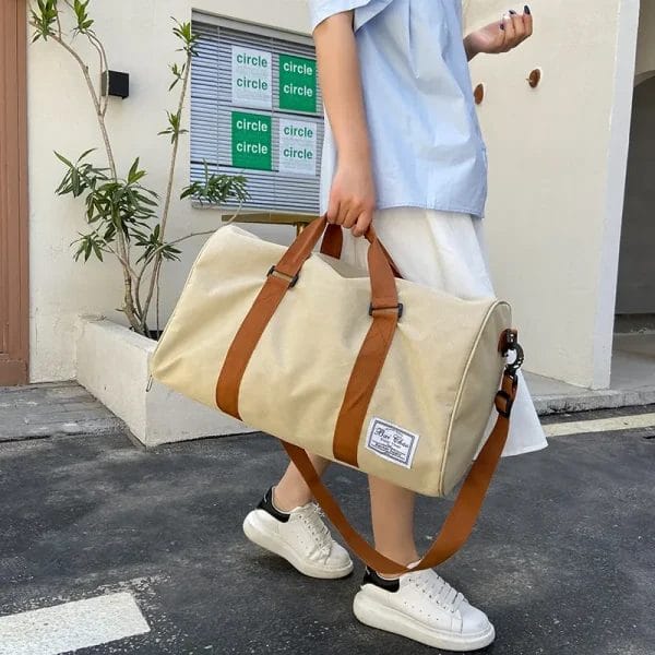The comfortable and removable shoulder strap of the Travel Bags Duffel Bag for versatile carrying.