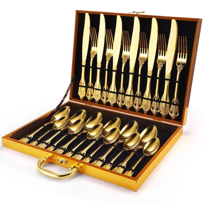A fine dining table setting featuring the Retro Royal Silverware Set Stainless Steel Cutlery on a white tablecloth.