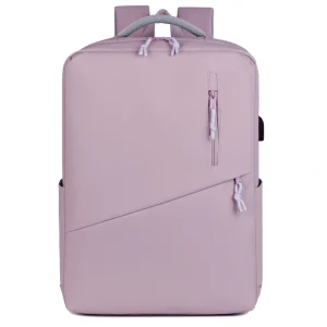 A person charging their phone via the built-in USB port of the Traveller Backpack while on the go.