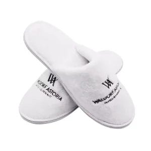 A top-down view highlighting the distinct left and right foot shapes of the anatomic Waldorf Astoria Slippers, a true luxury Hotel Velvet Slipper feature for superior comfort.
