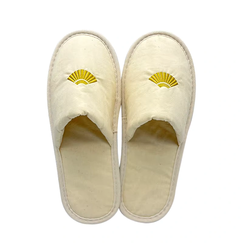 Close-up of a Cotton Cork Sole Slippers with a hotel logo subtly printed on the cotton upper, emphasizing customization for branding.