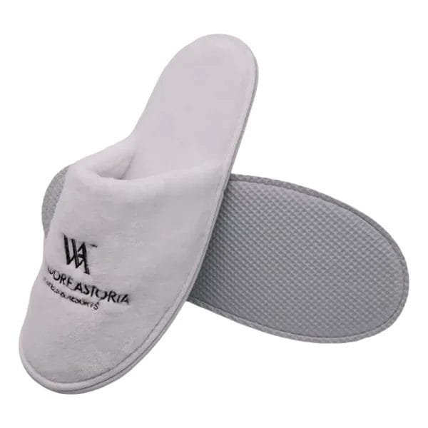 The robust 5mm textured sole of a Waldorf Astoria Slippers Hotel Velvet Slipper, engineered for lasting comfort, durability, and a silent step on any surface.