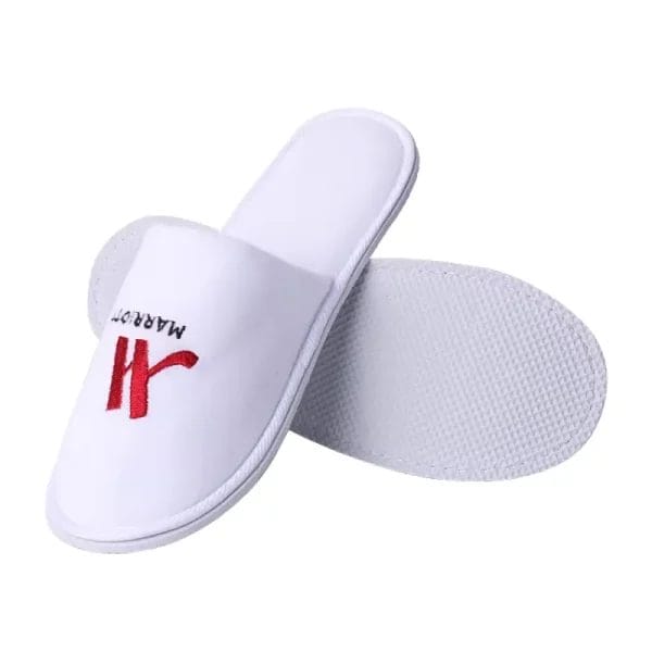 Side view of a Terry velvet Hotel Slippers revealing its thick, non-slip EVA sole, indicating durability and safety.