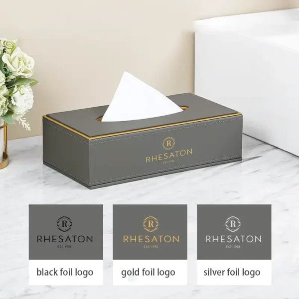A high-resolution photo of a complete PU Leather Hotel Amenities Box set, featuring a tissue box, tea box, and tray, meticulously arranged on a hotel bedside table.