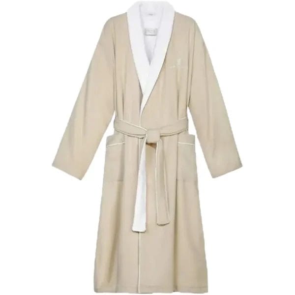 A close-up view of the meticulous white piping detail on the front patch pocket and cuff of a slate grey Luxury Hotel Bathrobe, highlighting its premium craftsmanship.