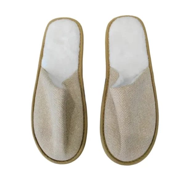 A pair of DERBAL's Hotel Eco-friendly Slipper showcasing the textured cotton-linen upper and distinctive natural cork sole, shot against a clean white background.