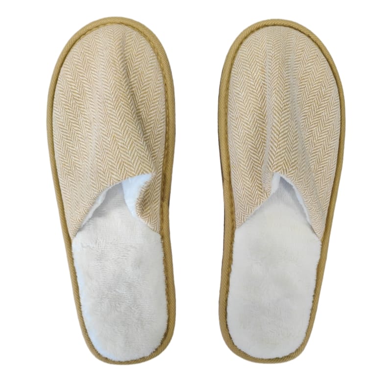 An angled view of a Hotel Eco-friendly Slipper revealing the contrast between its soft, plush fleece interior and the elegant herringbone weave of the upper.