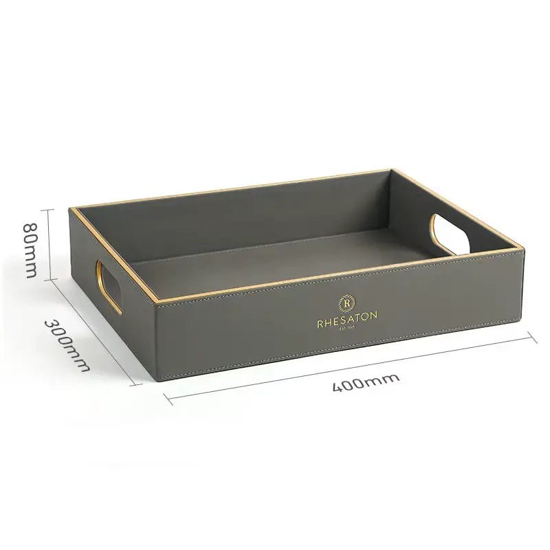 Lifestyle image of the PU Leather Hotel Amenities Box collection in a modern hotel bathroom, organizing toiletries and guest essentials.