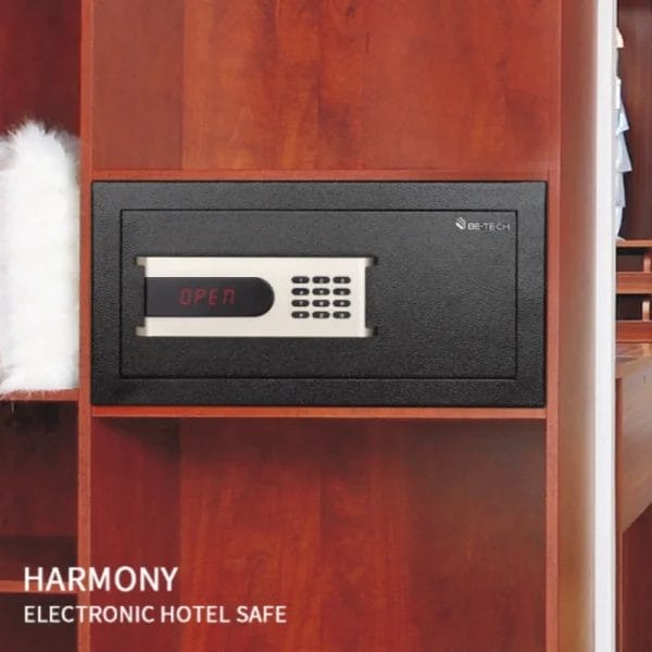 A security manager using the HSU (Handheld Service Unit) to service the Electronic Hotel Safe and retrieve the audit log.
