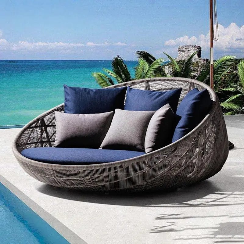 A clean, side profile of the Island Hotel Outdoor Sofa, emphasizing its sleek, contemporary, simple style.