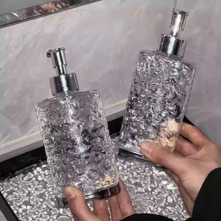 A Hand Sanitizer Dispenser Bottle filled with different liquids (lotion, soap, and shampoo), showcasing its multi-purpose utility.