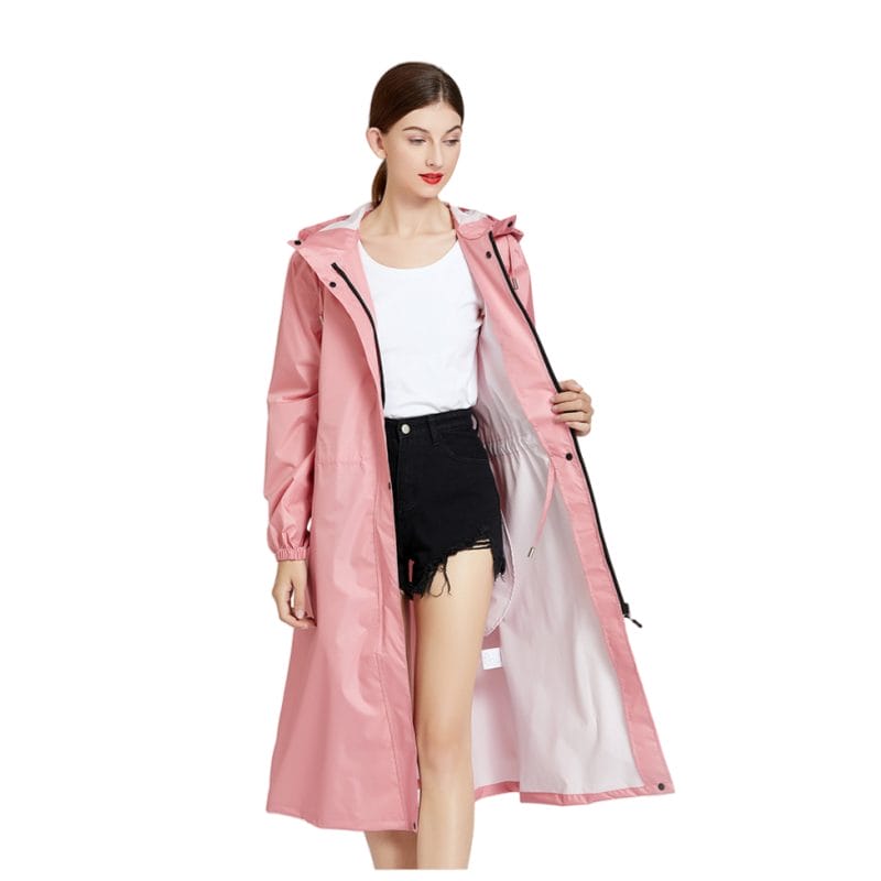 A full-length view of the Hotel Team Raincoat worn by a staff member, emphasizing its professional, uniform-matching style.