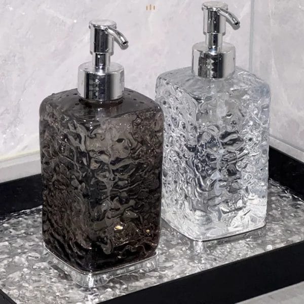 A Hand Sanitizer Dispenser Bottle with its minimalist, clear body, blending seamlessly into modern bathroom decor.