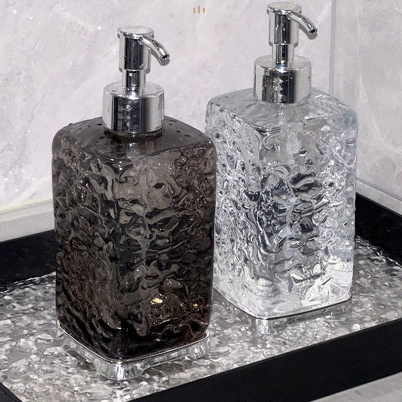 A Hand Sanitizer Dispenser Bottle with its minimalist, clear body, blending seamlessly into modern bathroom decor.