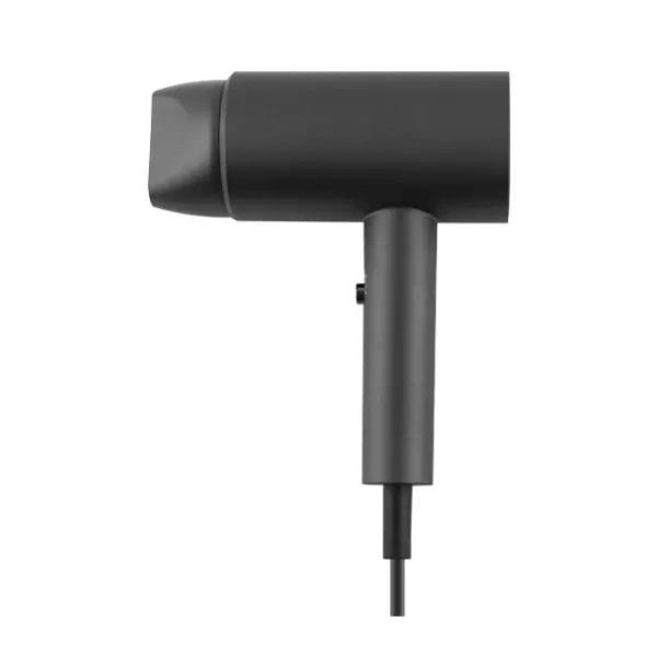 High torque hair dryer in hotel bathroom setting, emphasizing compact size and sleek design.