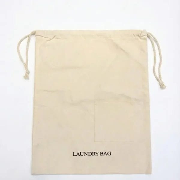 Front view of 8oz cotton hotel laundry bag featuring a 15.2cm pocket and LAUNDRY BAG embroidery.