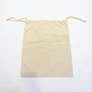 The back view of a high-density 8oz cotton canvas laundry bag for hotels, showing clean stitching and natural fabric.