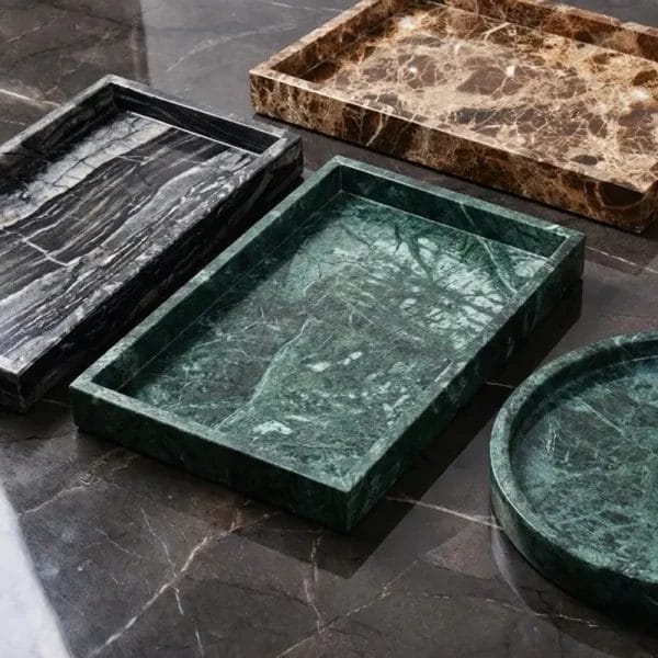 A sleek, black Marble Vanity Tray with white veins (Nero Marquina style) in a modern hotel suite.