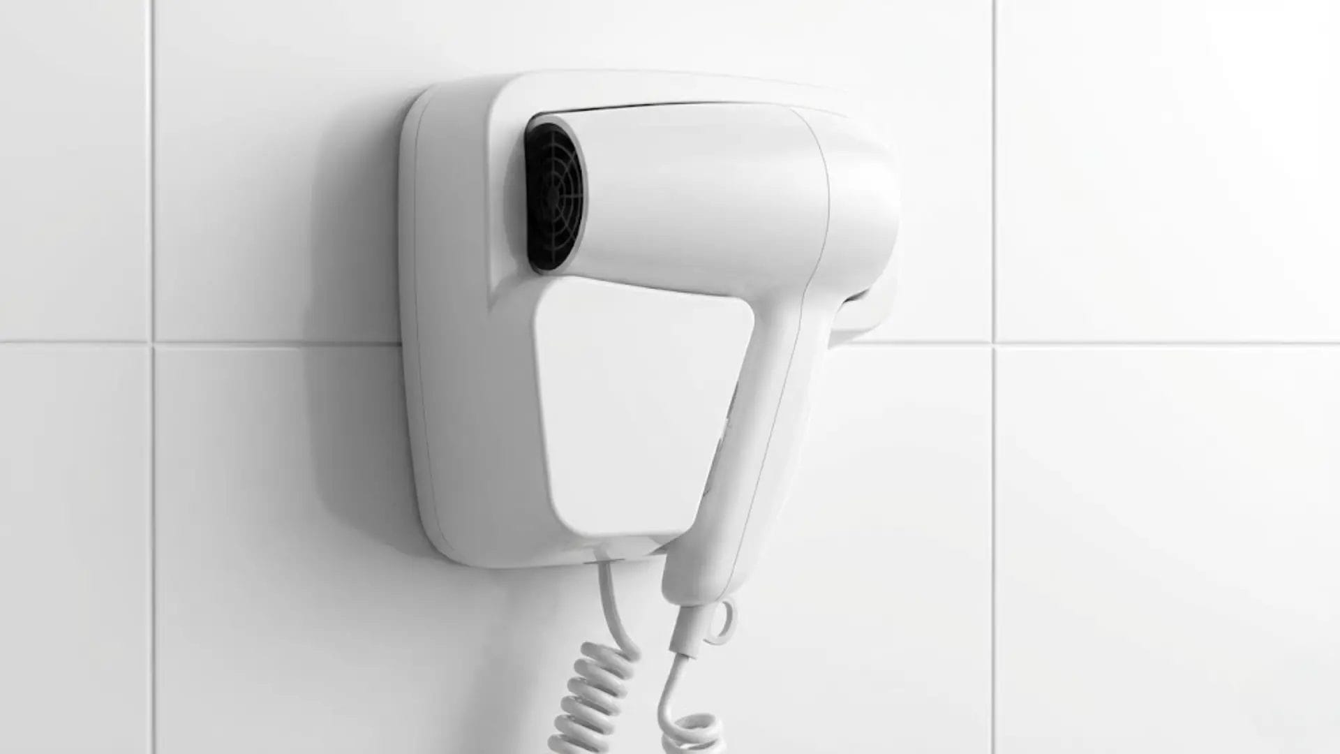 Close-up of the heavy-duty coiled cord and secure wall mounting base of a JINCHAN commercial hair dryer.